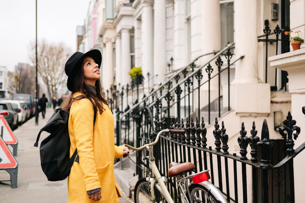 Female tourist looking at buildings on street