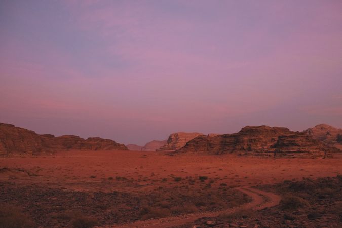 Sunset sky over rocks and valley
