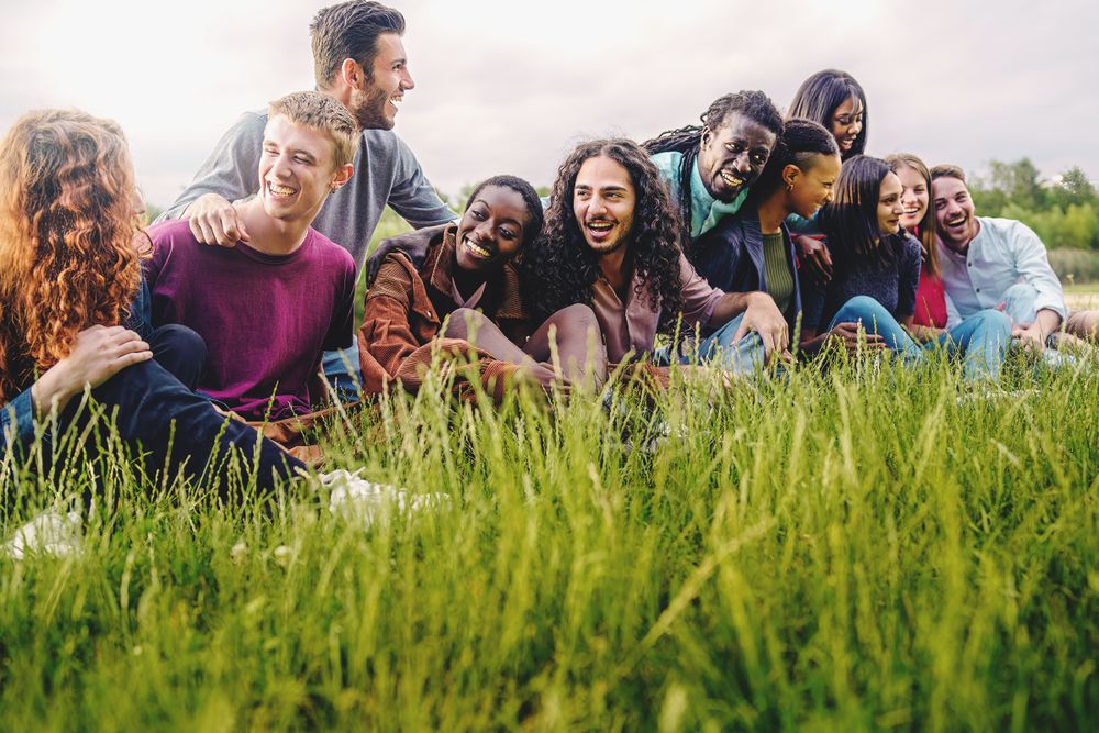 Diverse people hanging out in the park