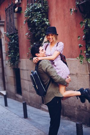 Happy couple having fun while walking in town