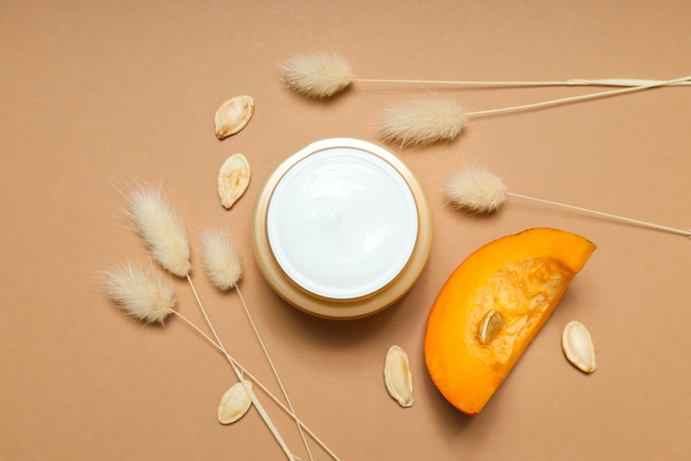 Concept of different cosmetic products, Pumpkin cosmetics, top view
