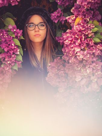 Woman on background of stunning violet flowers