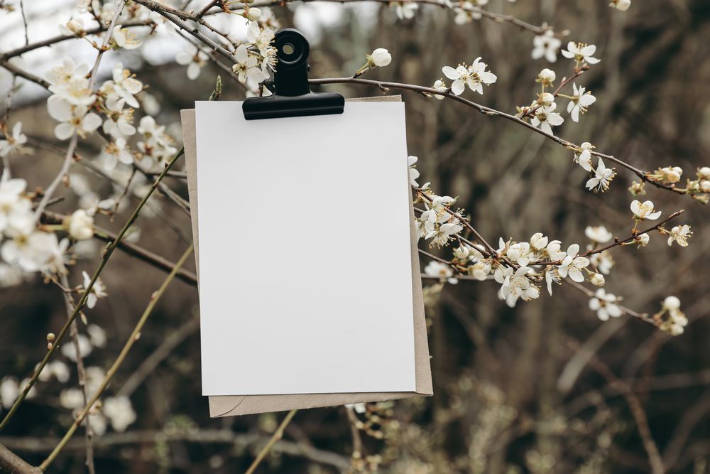 Spring wedding stationery mockup, blank greeting, birthday invitation card with metal bulldog clip