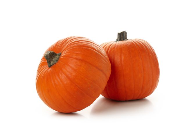 Two fresh pumpkins isolated on plain background