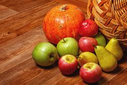 Table with autumnal fruit and squash
