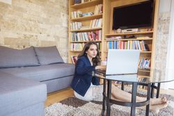 Elegant woman working on laptop