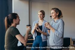 Three women relaxing with tea after a work out 5arNA4