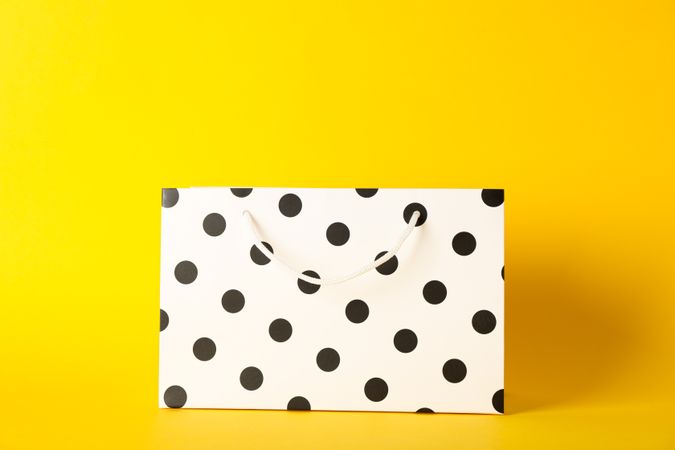 Paper bag on color background, space for text
