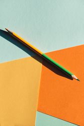 double-ended colored pencil on geometric  background