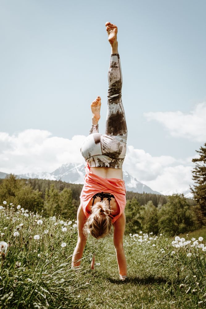 Woman hand standing in flower field