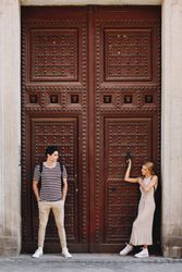 Happy couple having fun while walking in town