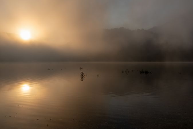 Sunrise on a foggy morning over Lake Sylvenstein in Bavaria, Germany