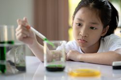 A girl doing a science experiment.