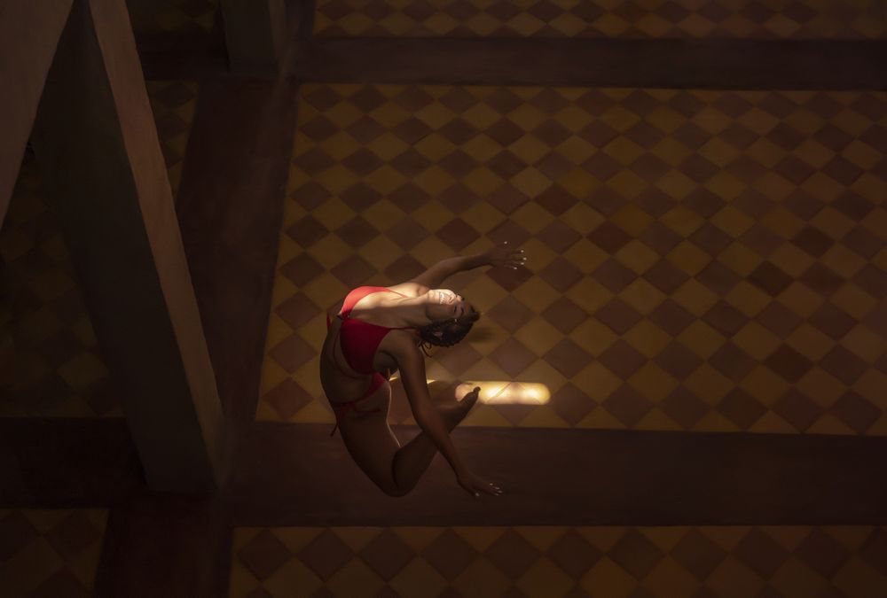 Woman dancing in dark church