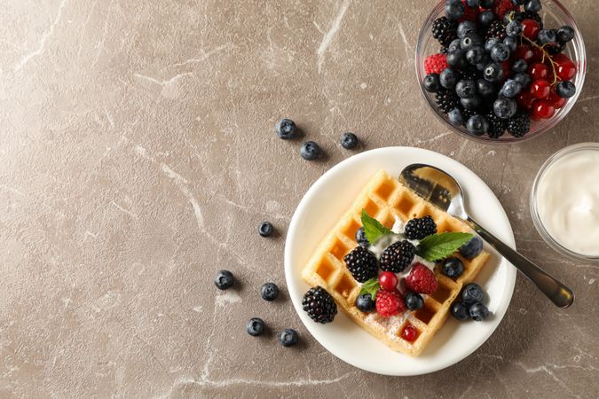 Composition of breakfast with belgian waffle, space for text