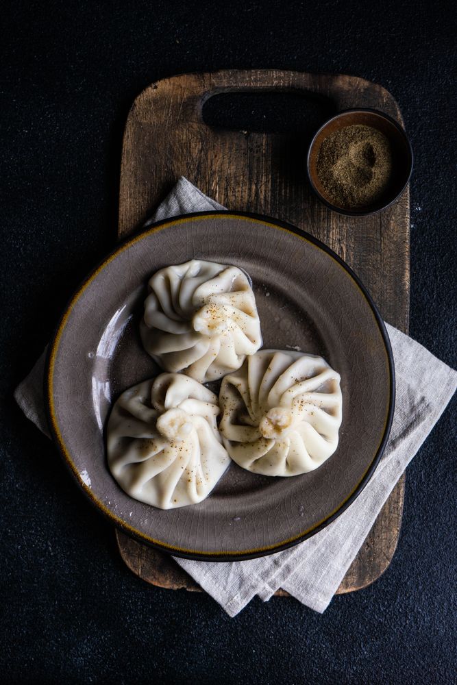 Top view of traditional Georgian khinkali dumplings served on plate