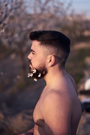 Man with flowers in beard