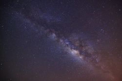 milky way galaxy with cloud and space dust in the universe, Long exposure photograph, with grain.