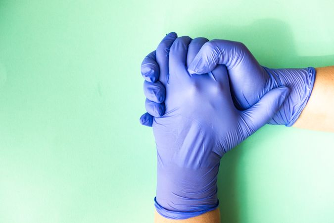 Covid-19 virus concept of hands in latex gloves