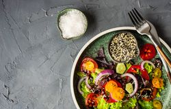 Top view of fresh organic vegetable salad with space for text