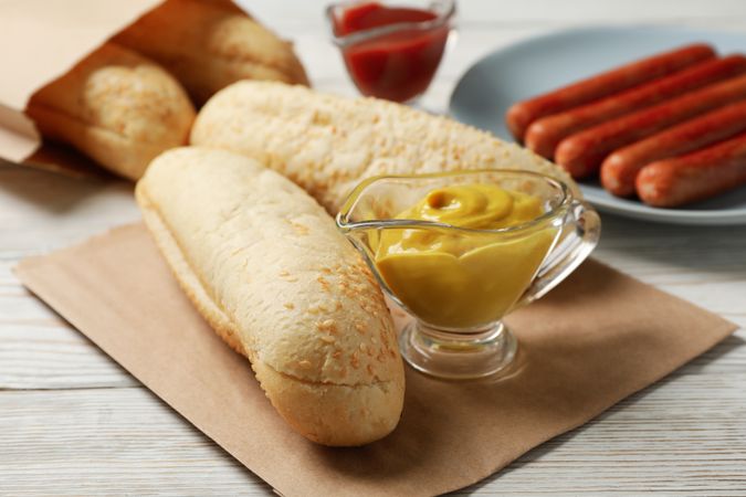 Ingredients for hot dog on plain wooden rustic background