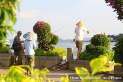 Three men fishing by shoreline 5QYne5