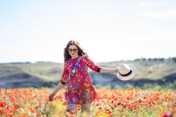 Excited woman laughing in field