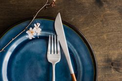 Spring table setting with blooming tree branch and cutlery with space for text