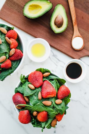 Strawberry served with almond and greenery
