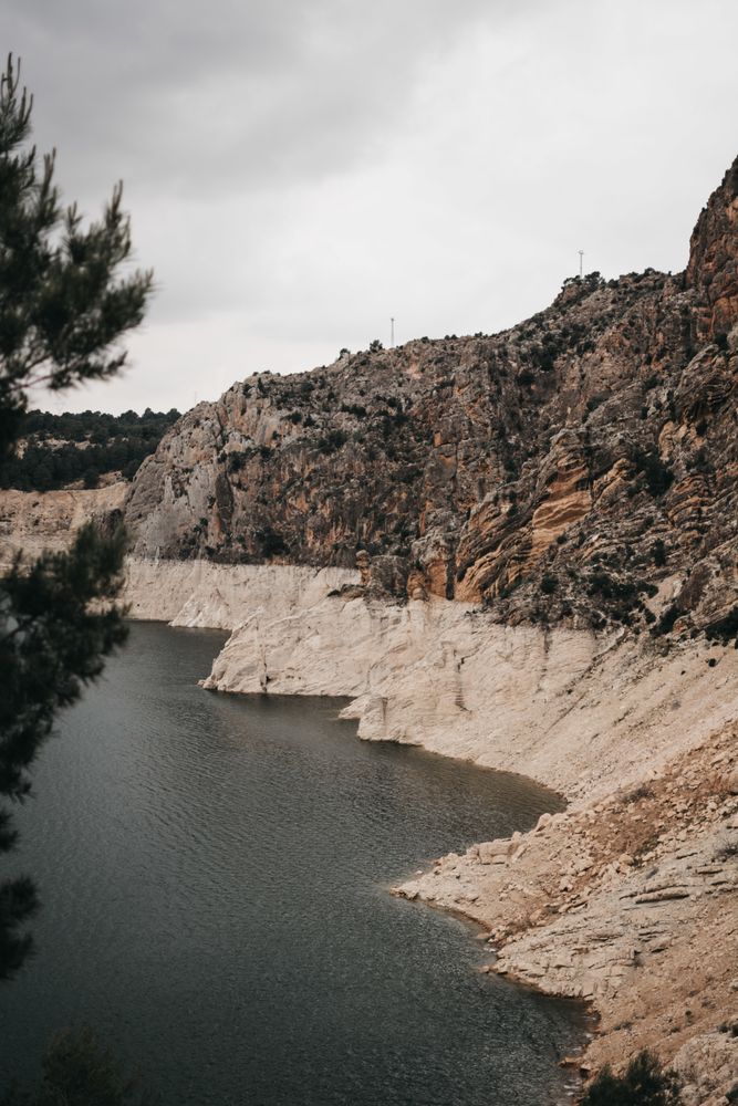 Rough cliff near calm water