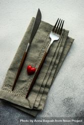 Heart decoration on grey napkin and silverware bGRRgB