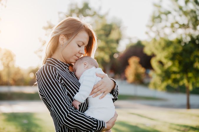 young mother hugging his baby with down syndrome