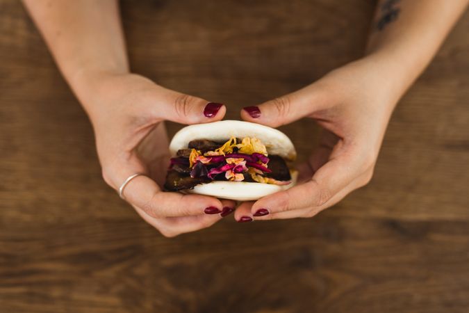 Woman holding Asian snack food