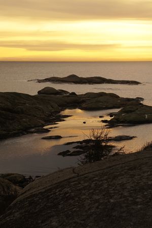 Rocky seashore at peaceful sunset