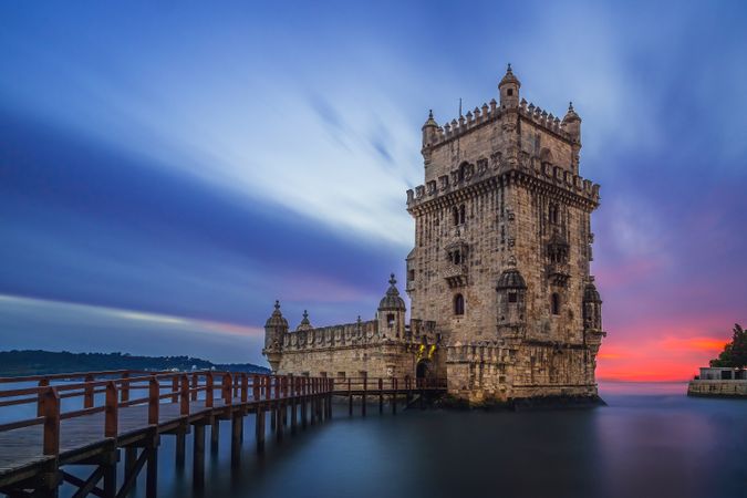 Medieval stone tower in dusky seascape