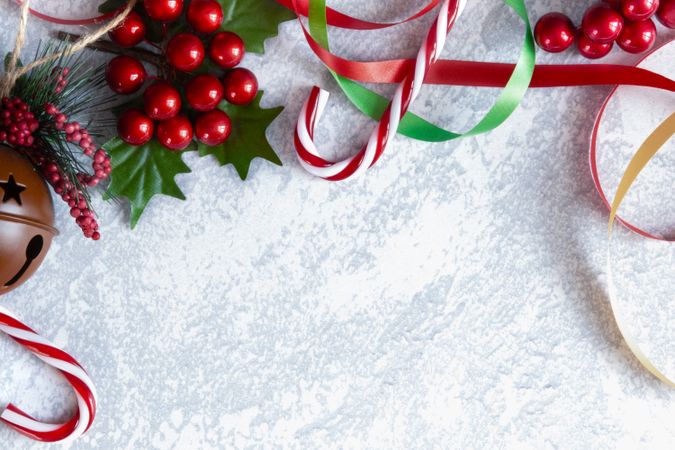 Christmas theme background with decorations on a grey backdrop.