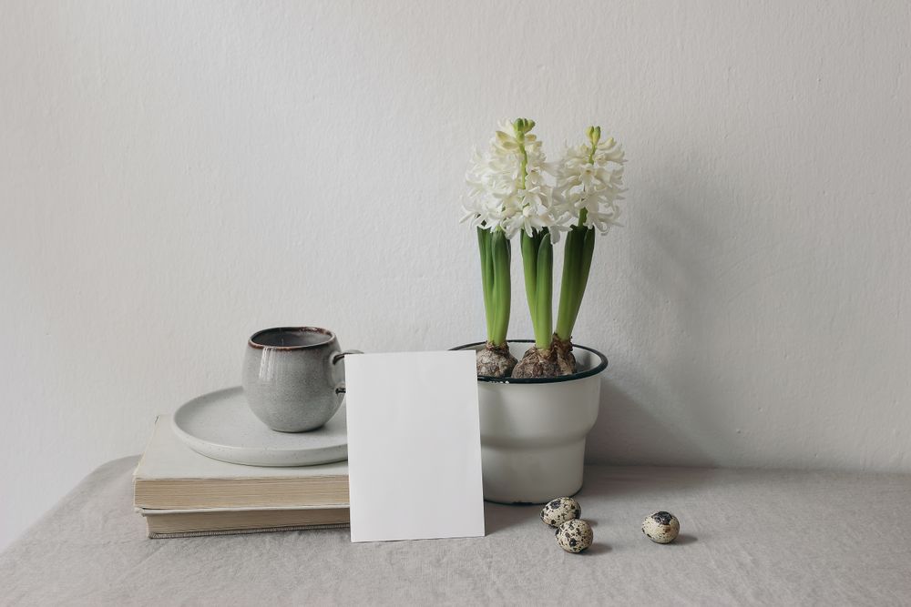 Cup of coffee, books. Linen table cloth.