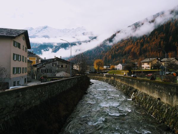 Autumn Frost: Frozen River in Poschiavo's Enchanting Village