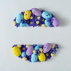 Easter eggs and purple flowers and leaves