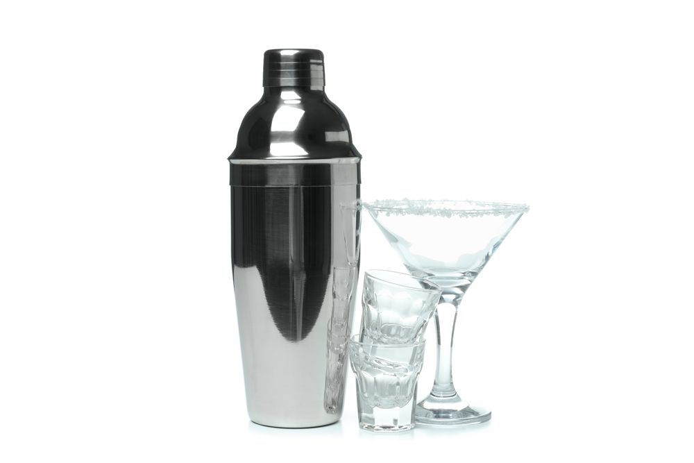Concept of preparing alcohol drink or cocktail, shaker, isolated on plain background