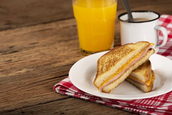 Grilled ham and cheese. Sandwich with cheese and ham on grill.