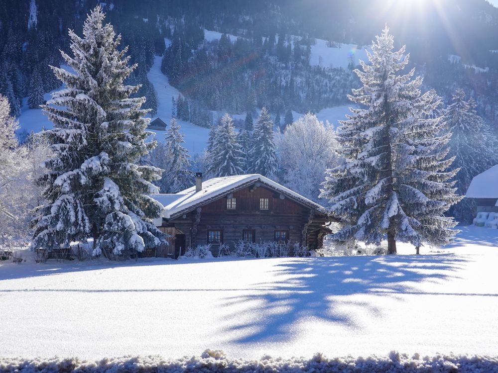 Swiss chalet under freshly fallen powder snow
