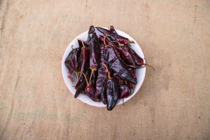 One bowl of Dry Pepper or red chili on the jute fiber fabric