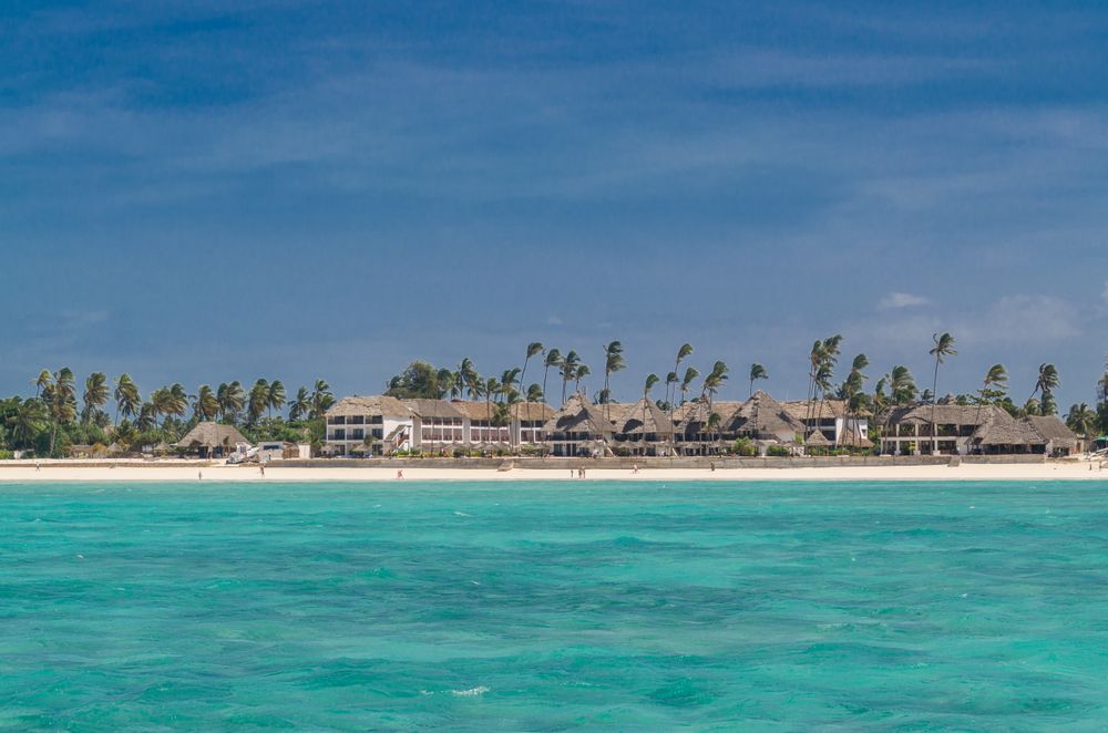 Tropical hotel as seen from clear water