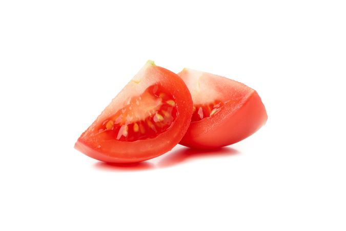 Fresh tomato slices isolated on neutral background
