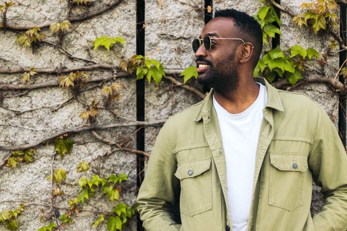 stylish and attractive Black young man with sunglasses portrait