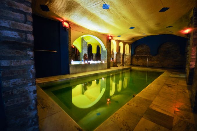 Dimly lit pool in Arab baths in Granada, Andalucia, Spain