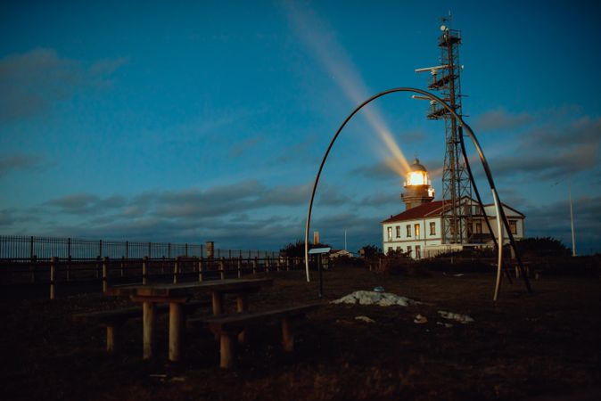 Road and lighthouse in evening