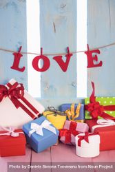 Multicolor gifts and the letters from the word “love” strung on a banner 43EGP0