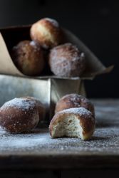 Baked cakes in craft paper on table